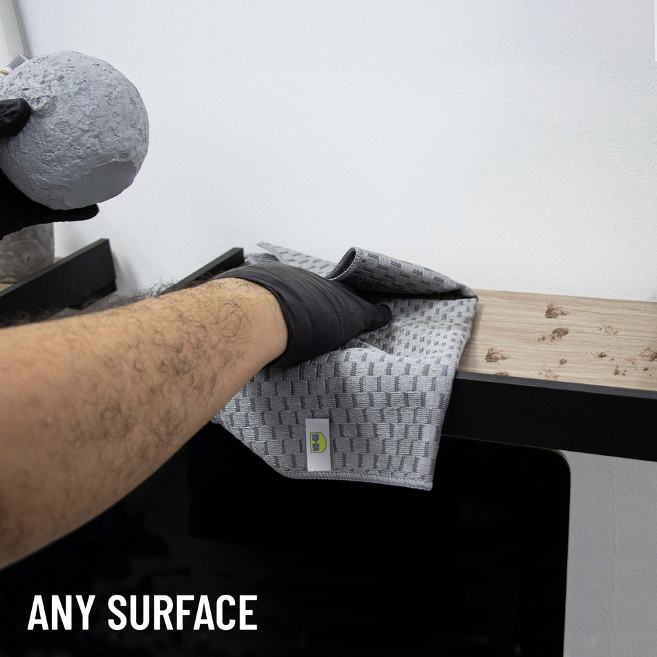 1 pack | model demonstrating cleaning action in use | 2-in-1 Multipurpose Microfiber Towel | L40180