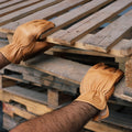 m | model wearing gloves on wood pallets | Cow Grain Leather Driver Gloves | GG309MC