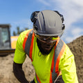 gray, Vented | model wearing helmet on construction site | Safety Helmet | Type 2, Vented with Koroyd® | GH500G