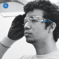 black/blue, Clear Anti-Fog | model wearing glasses, side profile view | Frameless Wrap-Around Safety Glasses — GE PPE 15 Series, Dielectric, ANSI Z87.1 | GE115CAF