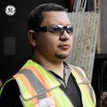 black/blue, I/O Mirror Anti-Fog | model wearing safety glasses profile view | Frameless Safety Glasses — GE PPE 05 Series, ANSI Z87.1 & EN 166 | GE205MAF