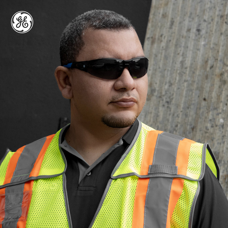 black/blue, Smoke Anti-Fog | model wearing frameless glasses outdoors | Frameless Safety Glasses — GE PPE 05 Series, ANSI Z87.1 & EN 166 | GE205SAF