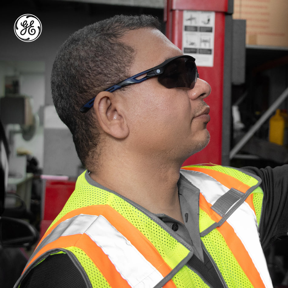 black/indigo, Smoke Anti-Fog | model wearing safety glasses in profile | Wrap-Around Safety Glasses — GE PPE 10 Series, Anti-Fog, ANSI Z87.1 | GE210SAF