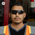 black, Smoke anti-Fog | model wearing sunglasses, front facing view | Wrap-Around Safety Glasses — GE PPE 01 Series, ANSI Z87.1 | GE201SAF