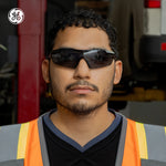 black, Smoke anti-Fog | model wearing sunglasses, front facing view | Wrap-Around Safety Glasses — GE PPE 01 Series, ANSI Z87.1 | GE201SAF