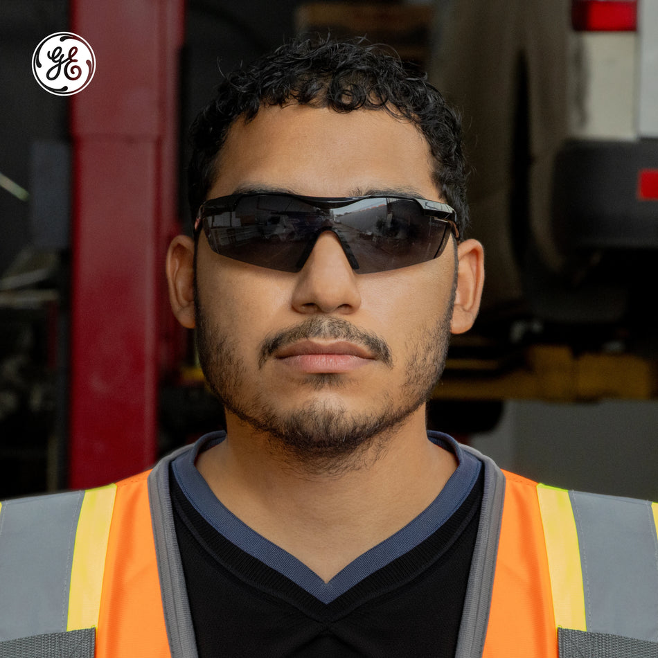 black, Smoke anti-Fog | model wearing sunglasses, front facing view | Wrap-Around Safety Glasses — GE PPE 01 Series, ANSI Z87.1 | GE201SAF