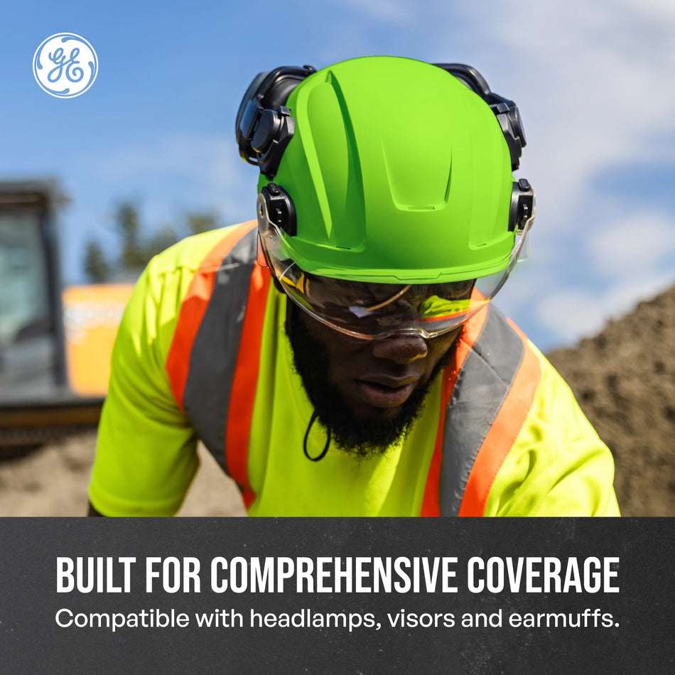 green, Non-Vented | model wearing helmet outdoors construction site | Non-Vented Type 2 Safety Helmet with Koroyd — GE PPE GH501, ANSI Z89.1-2014 Class E & G | GH501GN
