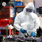 s | person wearing protective suit in workshop | Microporous Disposable Coverall Type 5/6 — GE PPE GW904, 63 GSM, Elastic Hood | GW904S