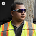 white/blue, Blue Mirror Anti-Fog | model wearing safety glasses outdoors | Wrap-Around Safety Glasses — GE PPE 10 Series, Anti-Fog, ANSI Z87.1 | GE110BAF