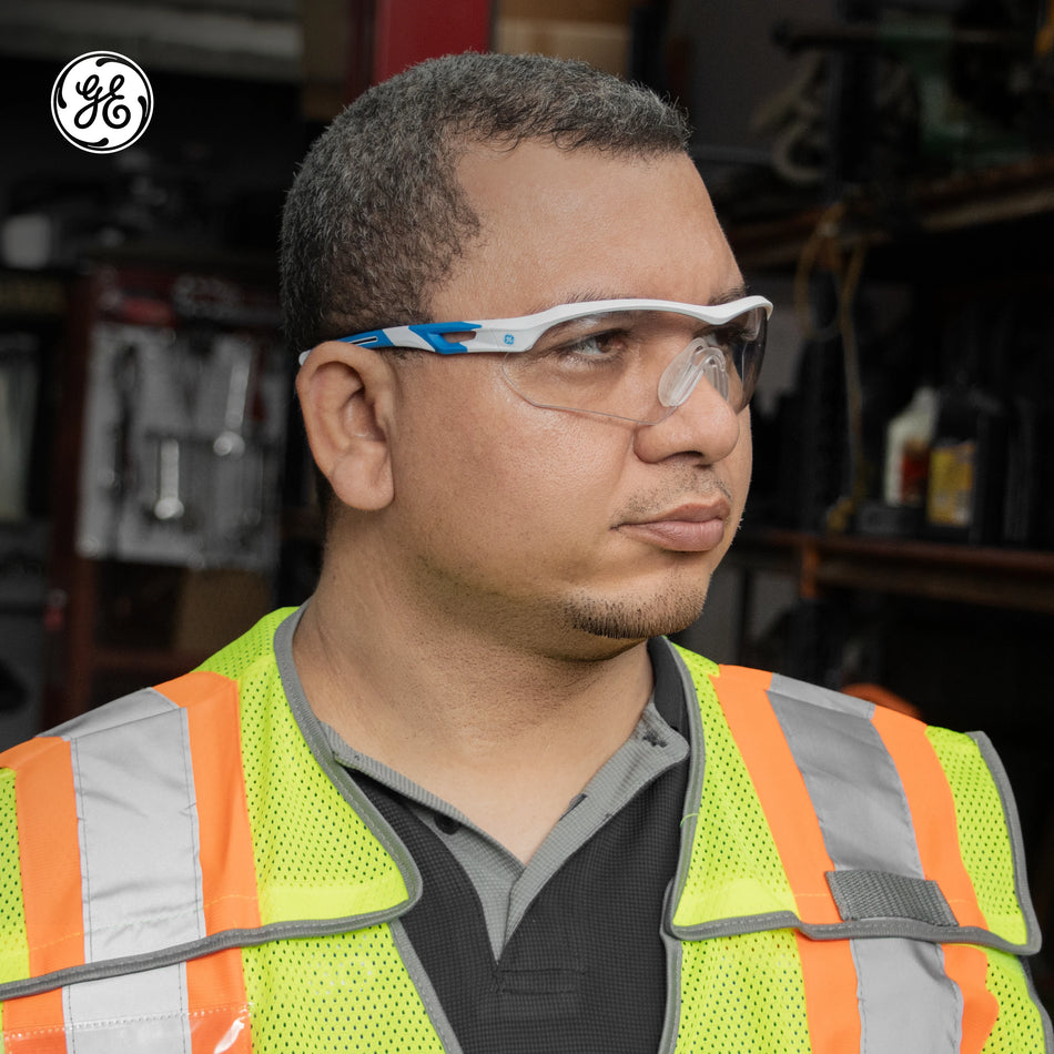 white/blue, Clear Anti-Fog | model wearing safety glasses side view | Wrap-Around Safety Glasses — GE PPE 10 Series, Anti-Fog, ANSI Z87.1 | GE110CAF